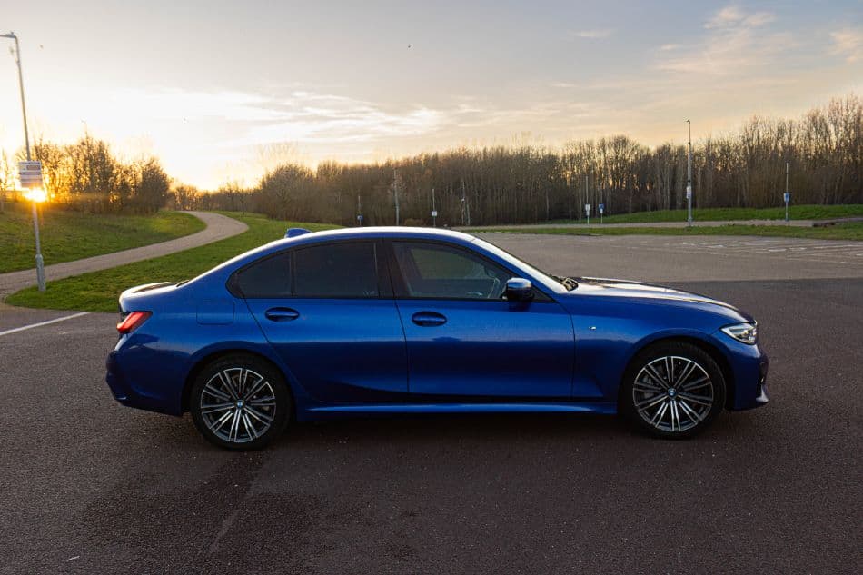 BMW 330e in a dark cinematic setting